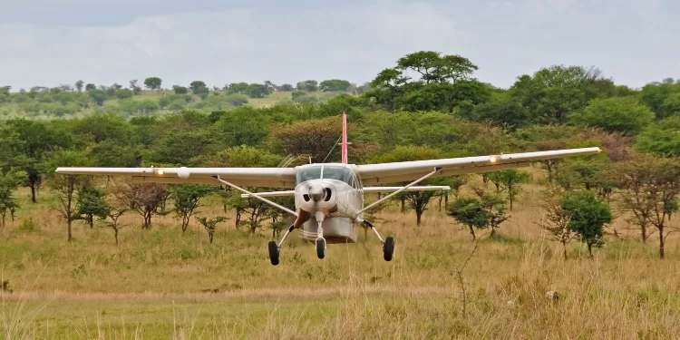 Small safari aircraft taking of from an airstrip in Serengeti National Park